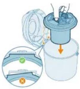 Illustration of a spray gun with a hand holding a lid, showing internal components and a magnified view of the gun's handle.