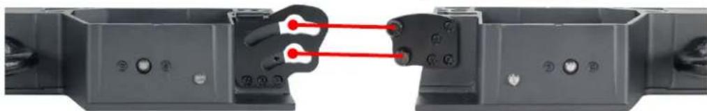 Close-up of a mechanical component with red connectors and mounting holes (no visible text or symbols)