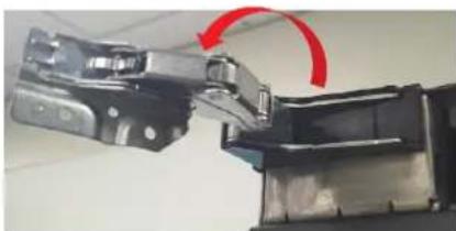 Close-up of a mechanical assembly with a red curved arrow indicating rotation or motion (no visible text or symbols)