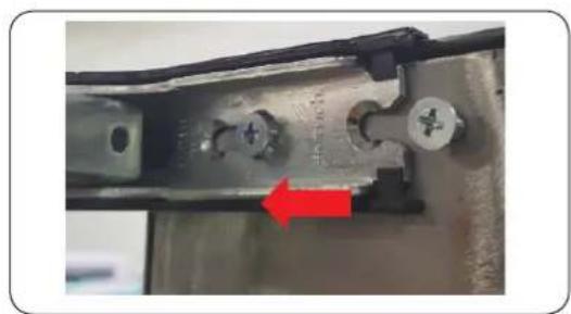 Close-up of a mechanical component with a red arrow pointing to a specific part (no visible text or symbols)
