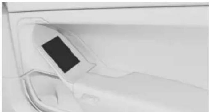 Close-up of a car's front wheel and side panel, showing no text or symbols