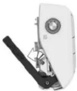 Close-up of a white mechanical device with a circular top and black lever mechanism (no visible text or symbols)