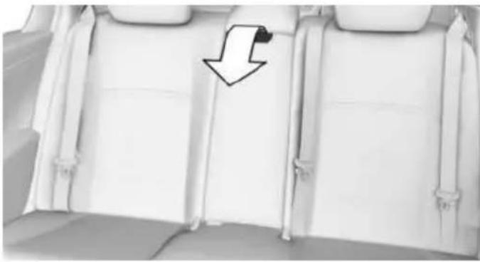 Interior view of a car seat with a downward arrow pointing to the backrest area (no text or symbols visible)