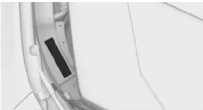 Close-up of a mechanical component with a black rectangular slot, possibly part of a device or tool (no visible text or symbols)