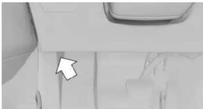 Close-up of a car's side panel with a white arrow pointing to the front panel (no text or symbols visible)