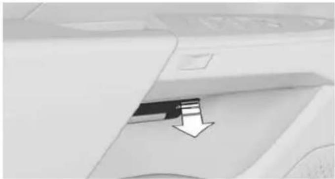 Close-up of a mechanical component with a downward arrow pointing to a small component (no visible text or symbols)
