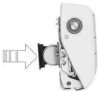 Mechanical device with a cylindrical component inserted into a housing, showing a right-angle arrow (no text or symbols)