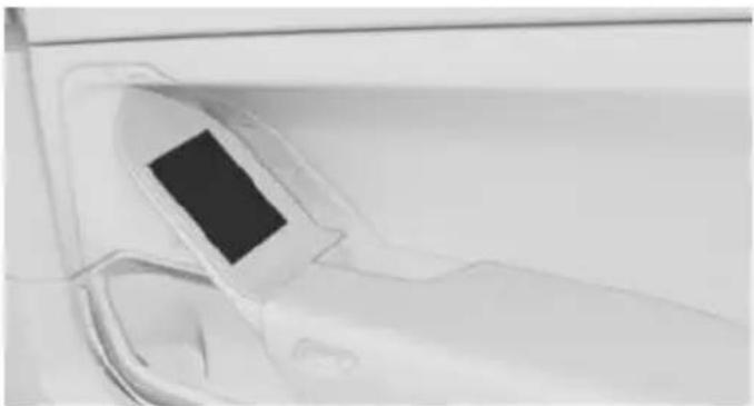 Close-up of a car's front panel showing the door and seat area (no visible text or symbols)