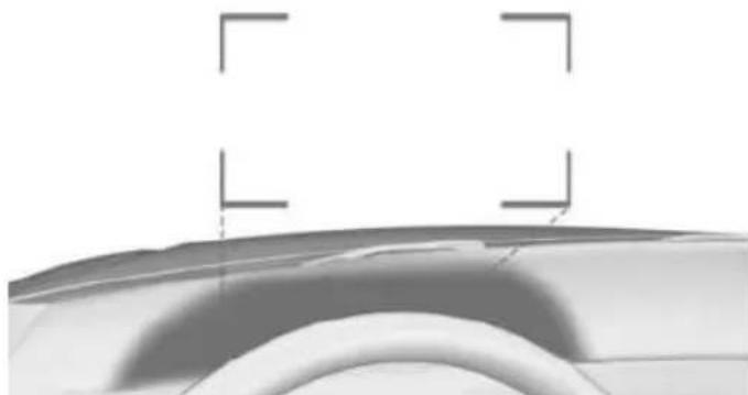 Close-up of a curved surface with two perpendicular alignment markers (no text or symbols)