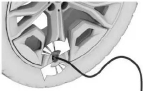 Diagram of a car wheel with a cable inserted into the center, showing no text or symbols.