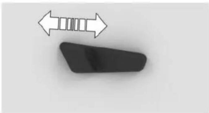 Simple diagram showing a black object with a white double-headed arrow pointing left, next to a segmented rectangular shape (no text or symbols)