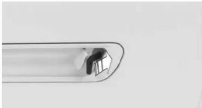 Close-up of a metallic tool tip with a small inset showing internal components (no text or symbols visible)