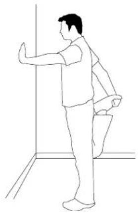 Line drawing of a person standing in a hallway, viewed from the side (no text or symbols)