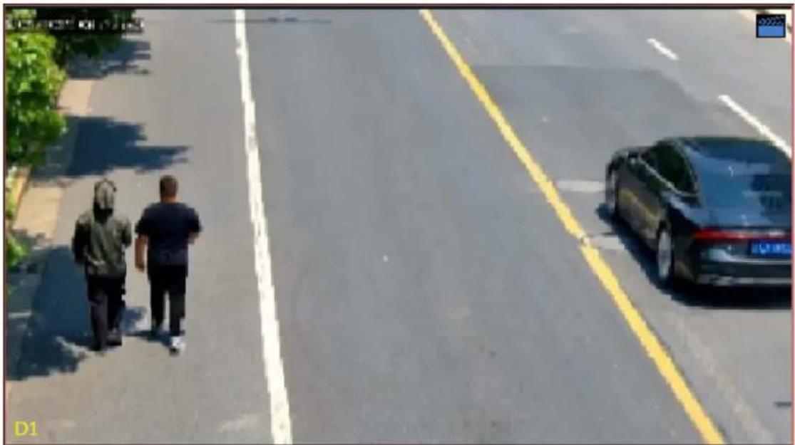 Street scene with two people walking on a road, a car parked nearby, and yellow lane markings (no visible text or symbols)