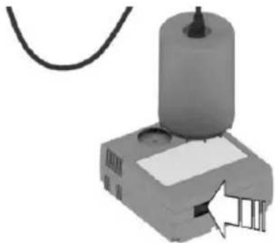 Mechanical device with cylindrical component and attached base, showing a cable and a small inset view (no text or symbols visible)