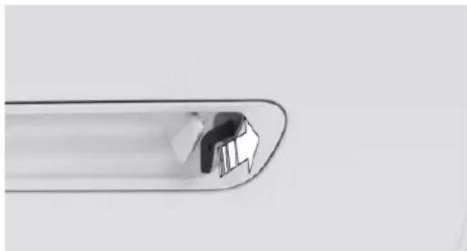 Close-up of a metallic tool tip with a small inset showing a mechanical component (no text or symbols visible)