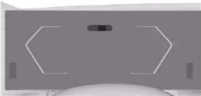 Top-down view of a computer monitor with abstract geometric shapes (no text or symbols)
