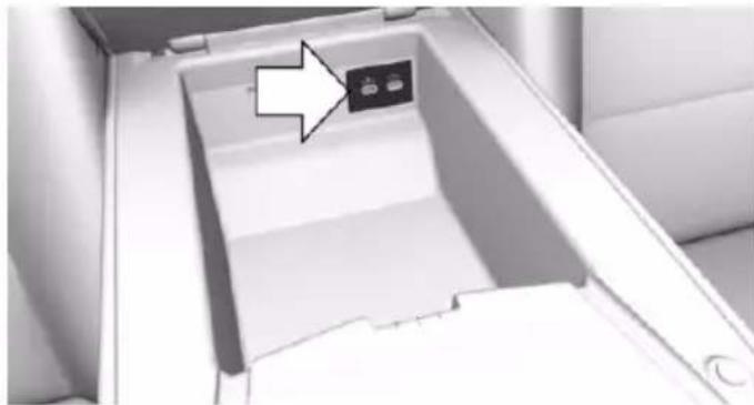 Interior view of a modern office space with a black arrow pointing to a small electronic device (no visible text or symbols)