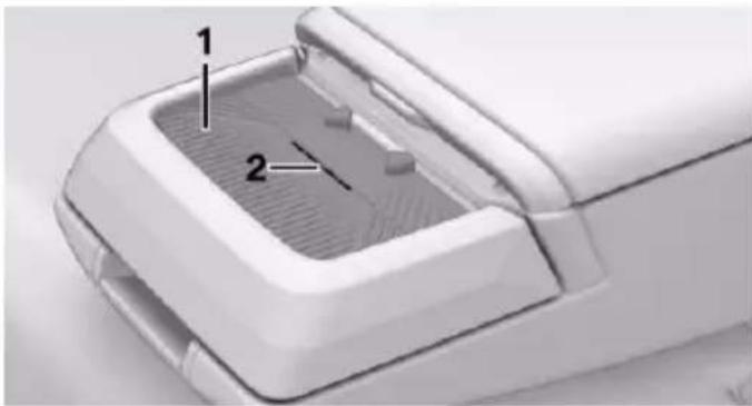 Close-up of a white plastic device's internal component with numbered callouts (1 and 2), no visible text or symbols beyond labels.
