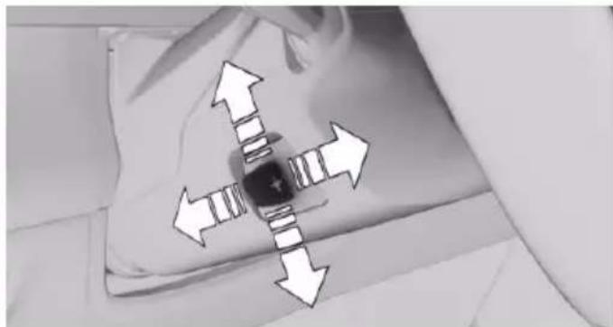 Black-and-white photo of a pillow with four arrows pointing outward from the center, indicating pressure or movement (no text or symbols)