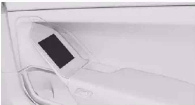 Close-up of a car's front wheel and side door, showing no text or symbols