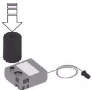 Diagram showing a device connected to a cylindrical component with an arrow indicating downward motion (no text or symbols present)