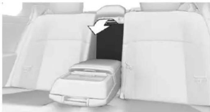 Interior view of a white car backseat with a seatbelt and a directional arrow pointing to the interior (no text or symbols visible)