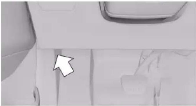 Close-up of a vehicle's rear window and side door, showing a white arrow pointing to the door area (no text or symbols visible)