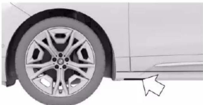 Side view of a car wheel rim and adjacent vehicle (no text or symbols visible)