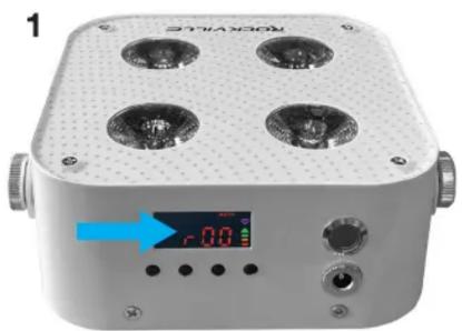 Front view of a white square electronic device with four circular vented lights and a digital display showing -0.0 dB (no readable text or symbols)