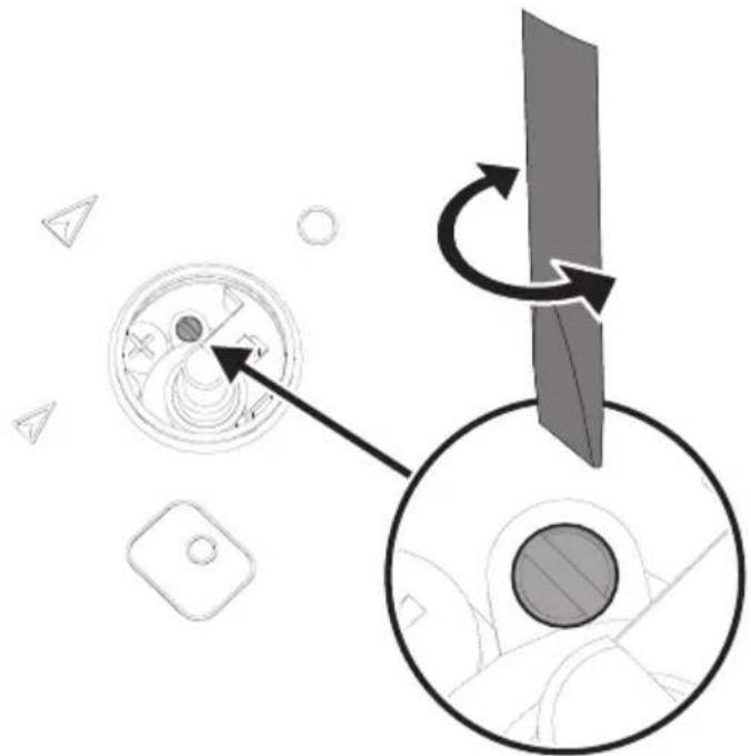 Diagram showing a circular device with internal components and a rotating arrow, no text or symbols present.