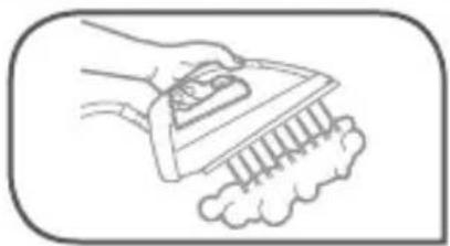 Line drawing of a hand using a power tool to clean or brush a piece of paper (no text or symbols)