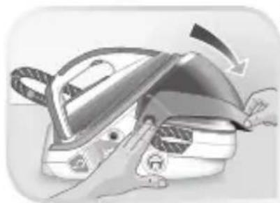 Illustration of a hand pressing down on a mechanical iron or iron piece (no text or symbols visible)