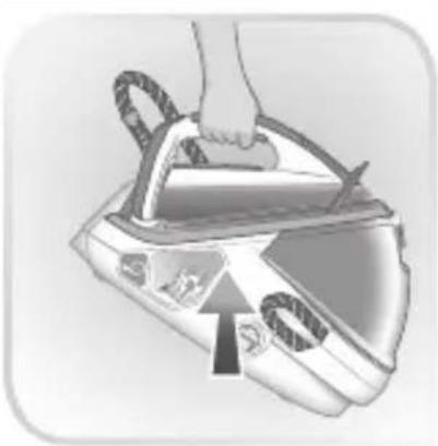 Illustration of a hand using a power iron to press down a device (no text or symbols visible)