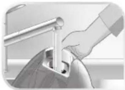 Close-up of a hand using a tool to press or install a mechanical component, no visible text or symbols