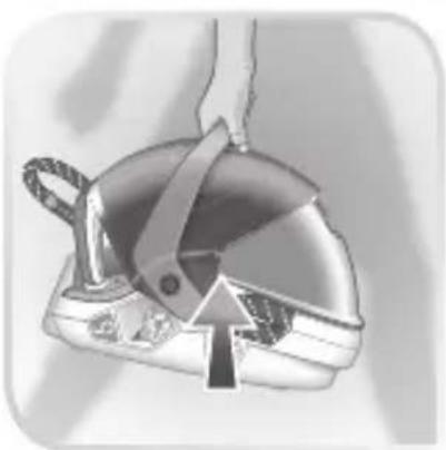 Illustration of a hand holding a small metal object with a handle, showing internal structure (no text or symbols)