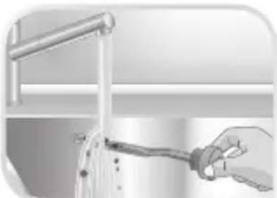 Illustration of a hand holding a tool near a vertical pipe or pipe outlet (no text or symbols visible)