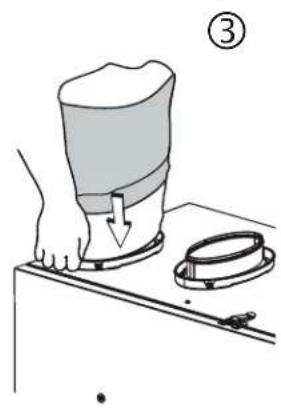 Illustration of a hand pressing down on a cylindrical object with a handle, next to a ring and a tool (no text or symbols)