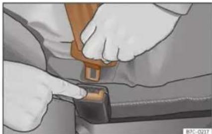 Close-up of hands adjusting a car seatbelt buckle (no text or symbols visible)