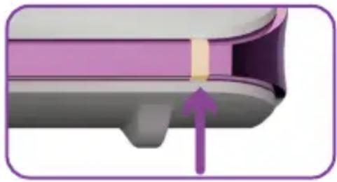 Close-up of a mechanical component with a purple arrow pointing to a section (no text or symbols visible)