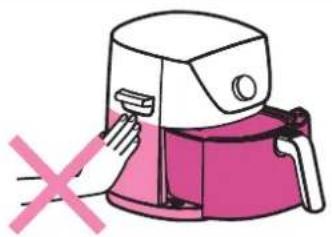Illustration of a hand using a pink electric cooker to clean or remove it, with a red X symbol indicating no text or symbols.