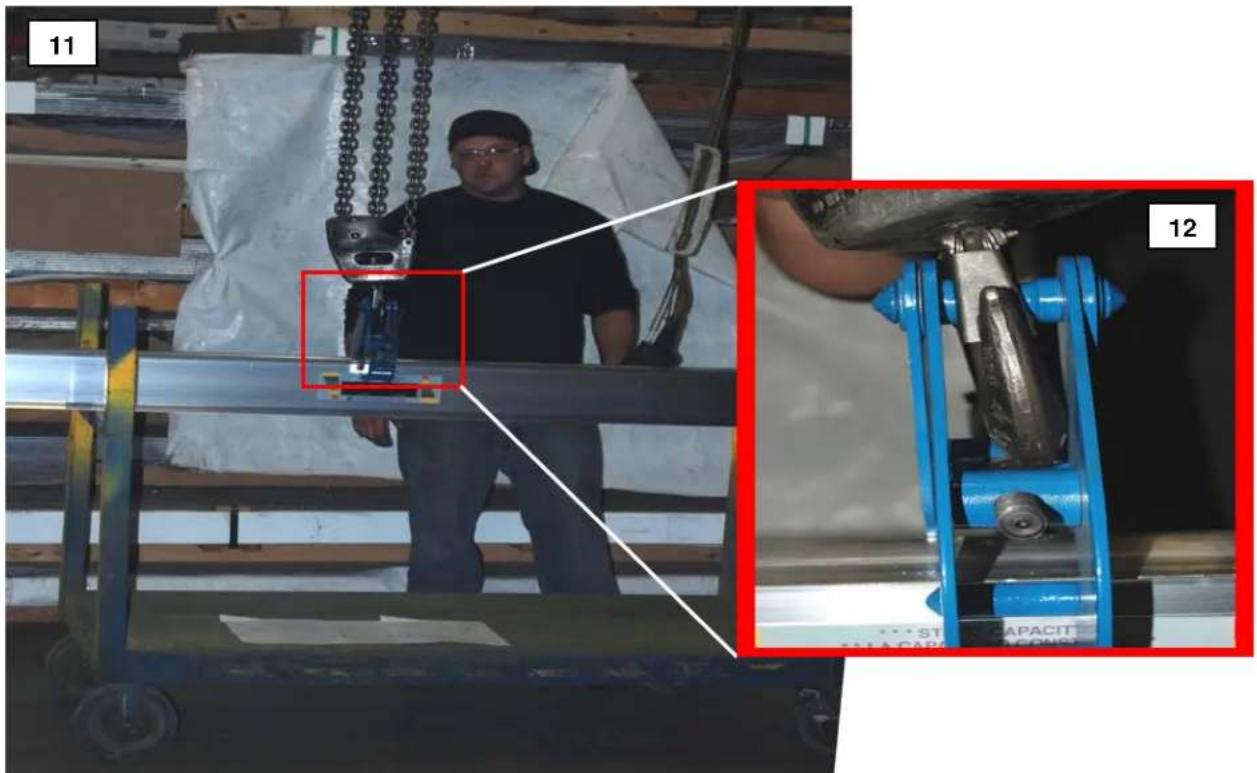 Interior view of a warehouse with a worker handling a mechanical device, showing close-ups of a blue industrial machine (no visible text or symbols)