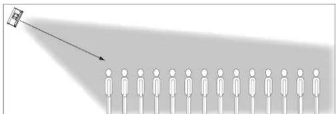Diagram showing a person projecting a small object from a light source, with no text or symbols present.