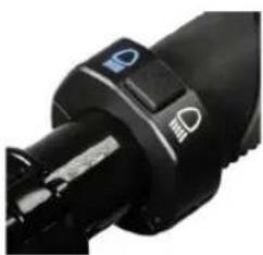 Close-up of a black mechanical device with a control knob and indicator lights (no visible text or symbols)