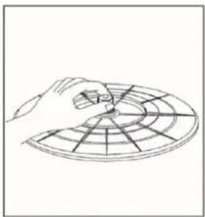 Hand holding a circular grid pattern with radial lines, no text or symbols present