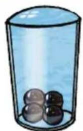 Illustration of a transparent glass with four small spheres inside, no text or symbols present