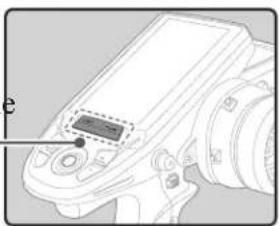 Line drawing of a camera with a digital display on the screen (no text or symbols)