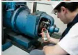 Person operating a blue industrial machine with a tool, no visible text or symbols