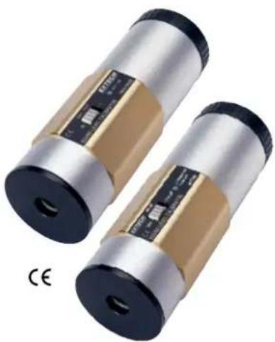 Two cylindrical electronic components with metallic and gold-colored casing, labeled CE (no text or symbols on the components themselves)
