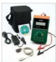 Assorted electronic devices including a multimeter, capacitors, and earplugs arranged on a white background (no visible text or labels)